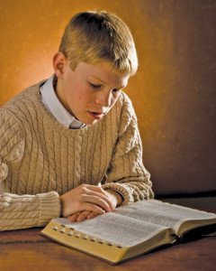 Mormon teenager studying Doctrine and Covenants