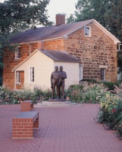 A picture of Carthage jail showing statues of Joseph Smith and Hyrum Smith where they were martyred and died at the hands of a mob.